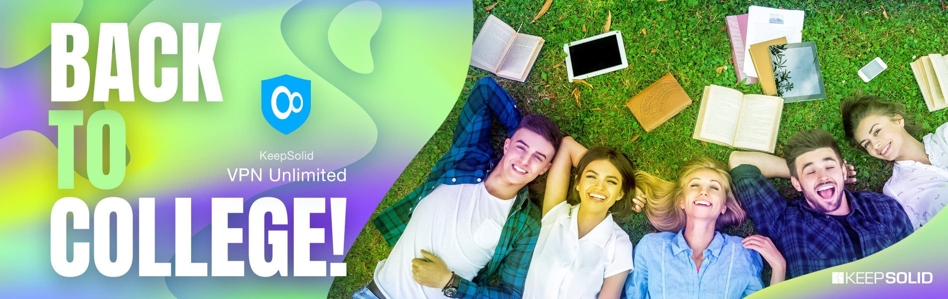 Group of students lying on the grass, enjoying their break and using VPN for college.