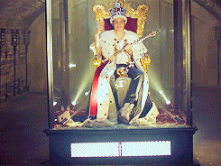 Giphy. BBC Sherlock. Moriarty sitting like a king.